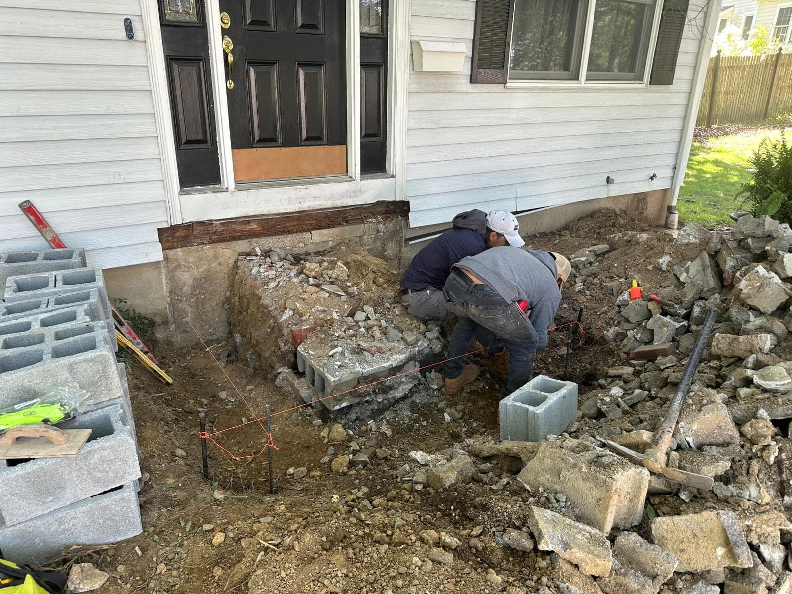 Masonry wall being repaired by craftsman